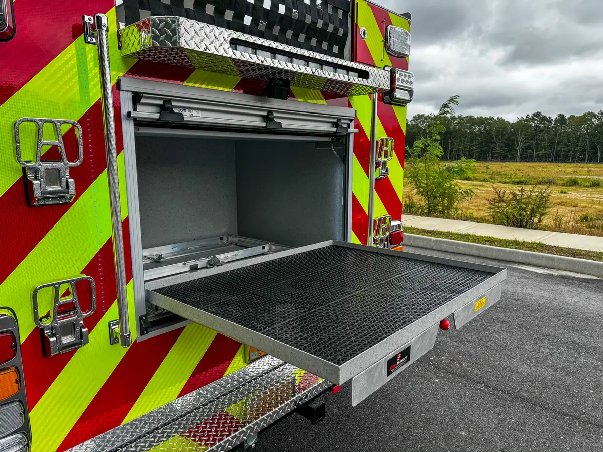 Rear compartment interior close-up with upper corner wiring and wall texture.
